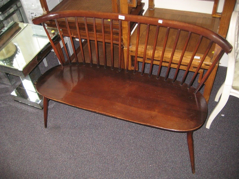 1960's Ercol dark ash love seat having comb back on: 1960's Ercol dark ash love seat having comb back on splay supports