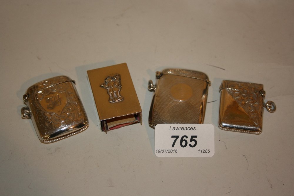Three various silver vesta cases and a silver match box (1 of 1)