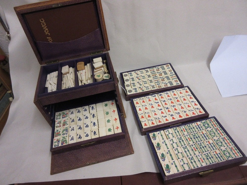 Good quality bone and bamboo mah-jong set housed in a: Good quality bone and bamboo mah-jong set housed in a four drawer leather cabinet
