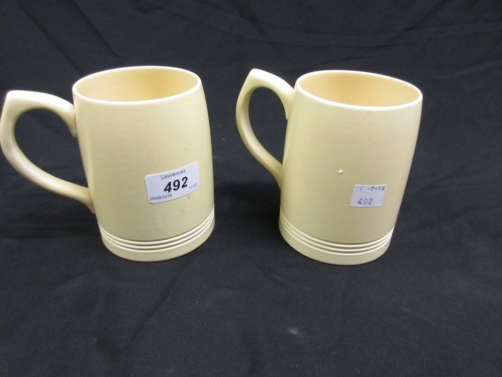 Pair of Keith Murray for Wedgwood cream ground pottery: Pair of Keith Murray for Wedgwood cream ground pottery mugs