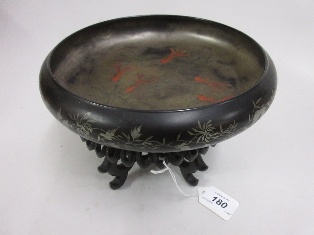 Oriental lacquer shallow bowl decorated internally with (1 of 2)