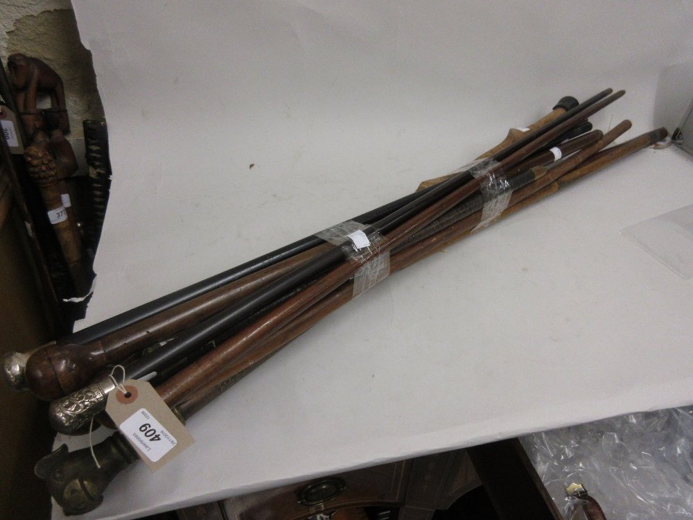 Two silver topped ebonised cane walking sticks and a (1 of 1)