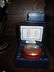 Two boxed Halcyon Days enamel boxes, together with a