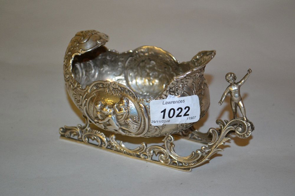 19th Century Dutch silver model of a shell form sled: 19th Century Dutch silver model of a shell form sled with all-over embossed decoration and putto figure head