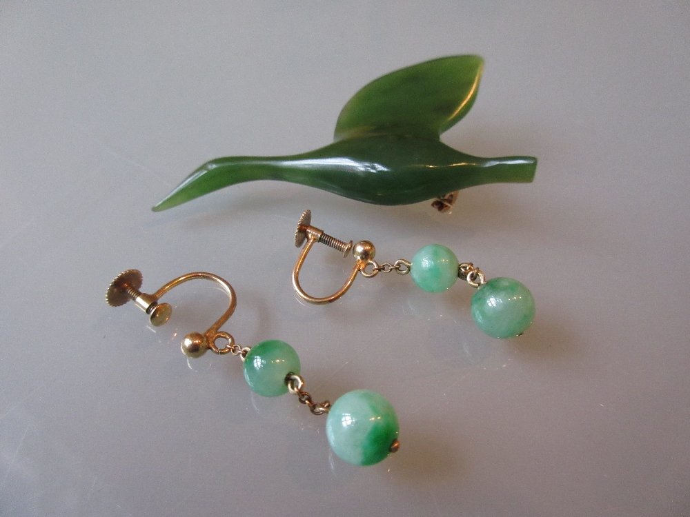 Pair of jade bead and yellow metal earrings together (1 of 1)