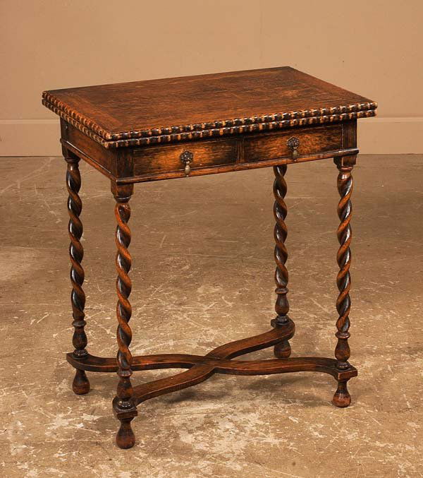 Jacobean oak lift top game table on barley twist l: Jacobean oak lift top game table on barley twist legs with cross-stretcher, c.1900, 24" wide, 16" deep, 28" high