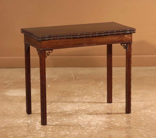 Chippendale style mahogany lift top game table on s: Chippendale style mahogany lift top game table on straight molded legs, 34" wide, 17" deep, 29" high