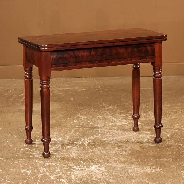 American Sheraton mahogany lift top game table on t: American Sheraton mahogany lift top game table on turned legs, c1860, 36" wide, 18" deep, 29-1/2" high