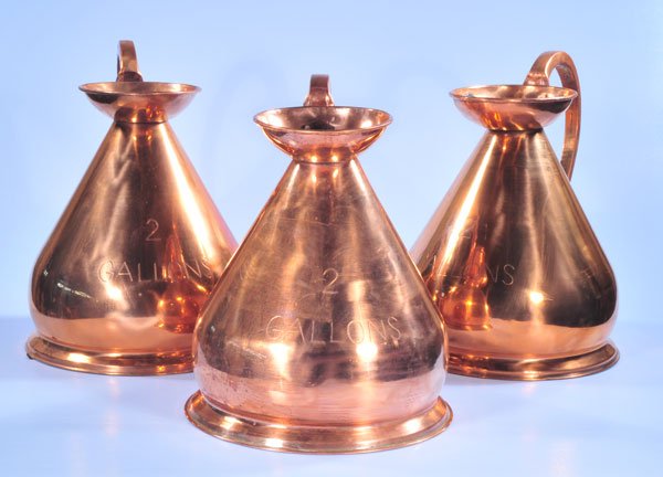 Group of three two gallon copper measuring jugs, 