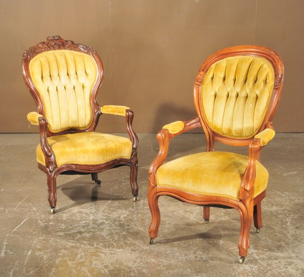 Two companion American Victorian walnut armchairs