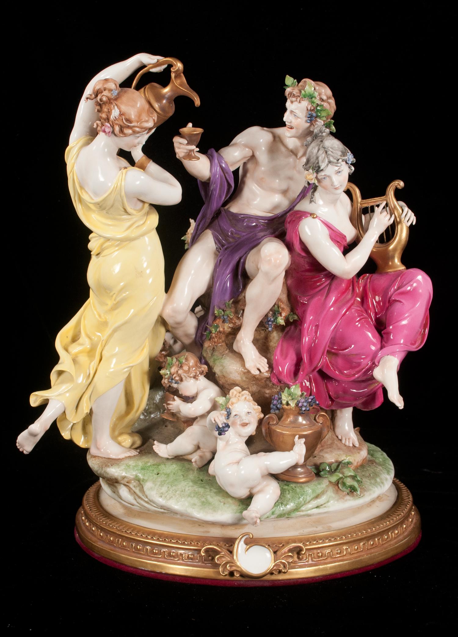 Fine Capo di Monte porcelain figural group: Fine Capo di Monte porcelain figural group with a man holding a cup, a lady pouring wine, a lady playing a harp and four children at the base, 14" high