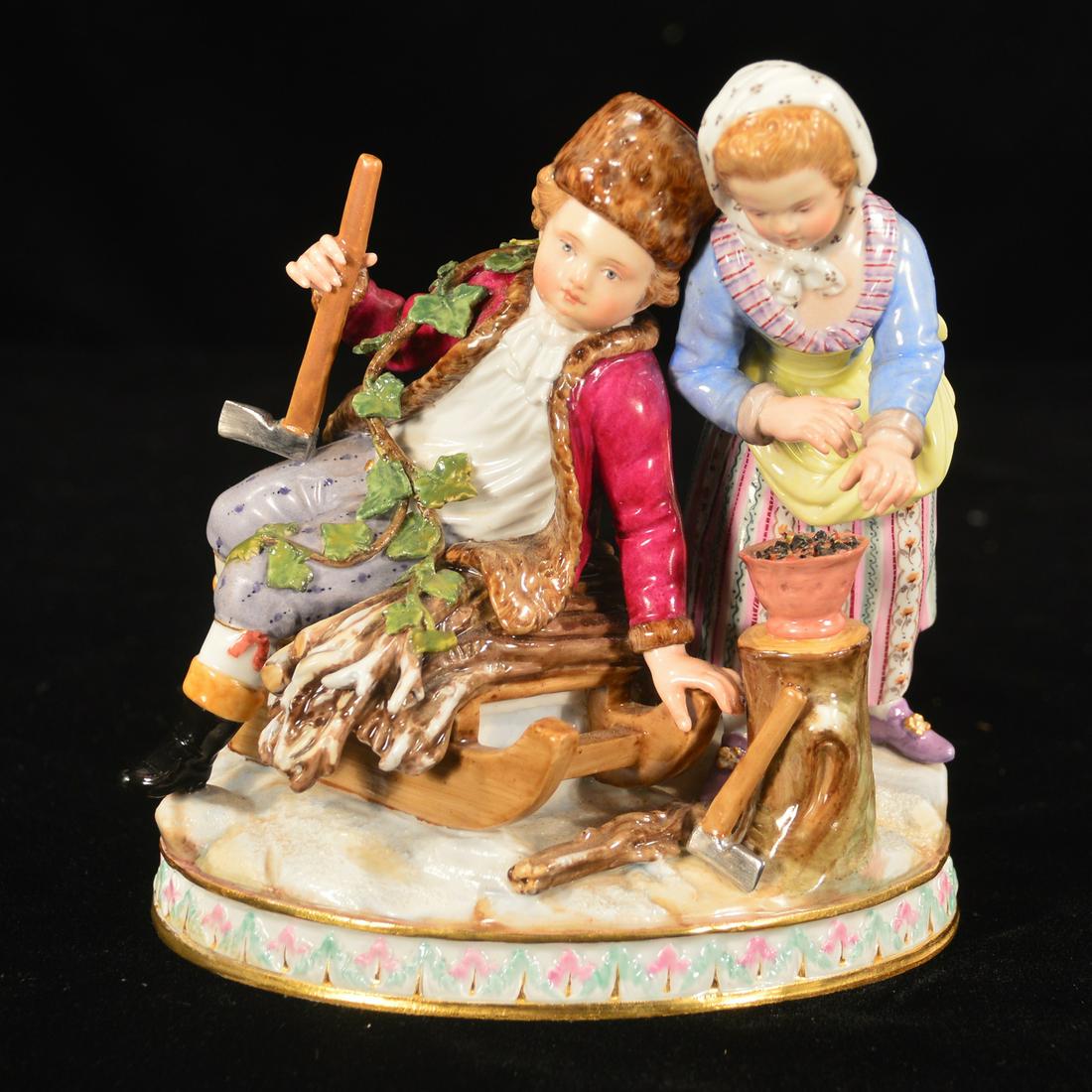 Meissen figural group: Meissen porcelain figural group of a young ax-man seated on a sleigh of wood and a lady standing next to him, 6" high
