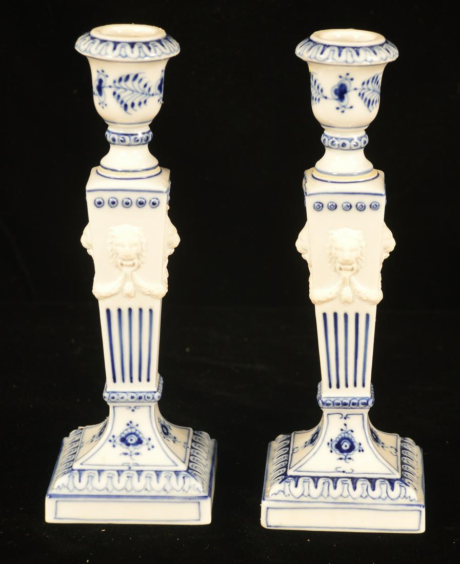 Pair of Delft candlesticks: Pair of blue and white Delft candlesticks with lion masks on the body, 9" high