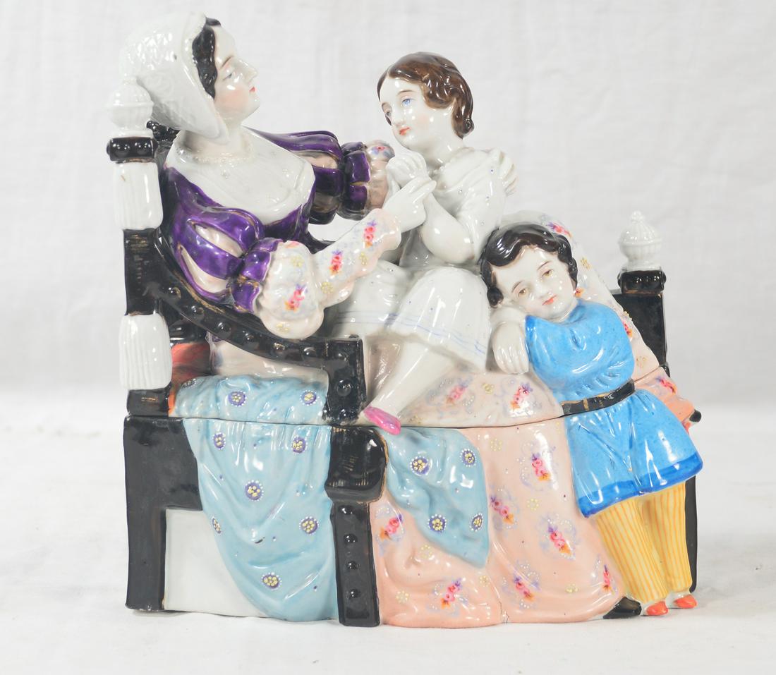 Staffordshire porcelain inkwell: Staffordshire porcelain inkwell in the figure of a seated lady with her daughter in her lap and her son standing at her feet, 8.5" wide, 4" deep, 8.5" high