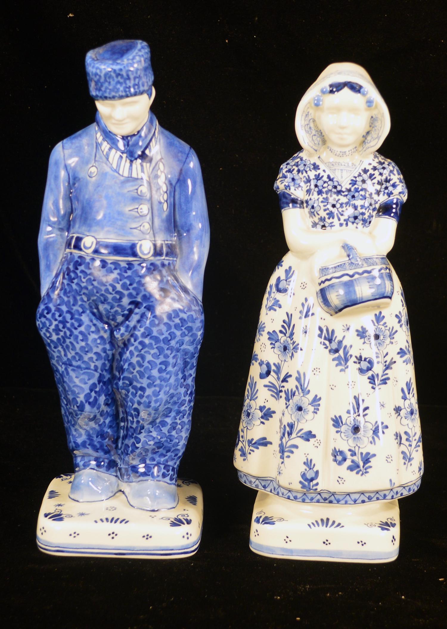 Pair of Delft figures: Pair of Delft blue and white figures of a Dutch man and woman, 12" high
