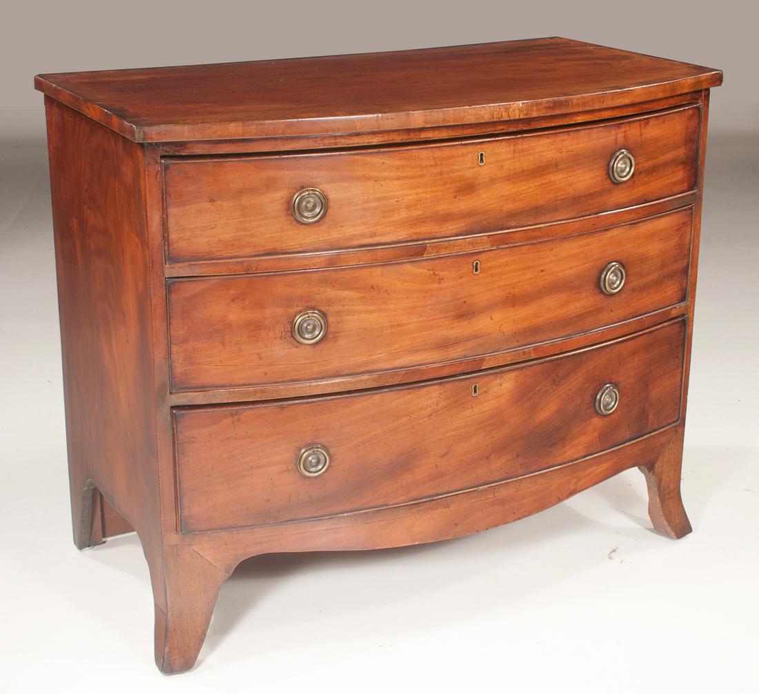 Sheraton mahogany bow front chest with cross banded top: Sheraton mahogany bow front chest with cross banded top, three full graduated drawers and on splay legs, c.1860, 40" wide, 22" deep, 33" high