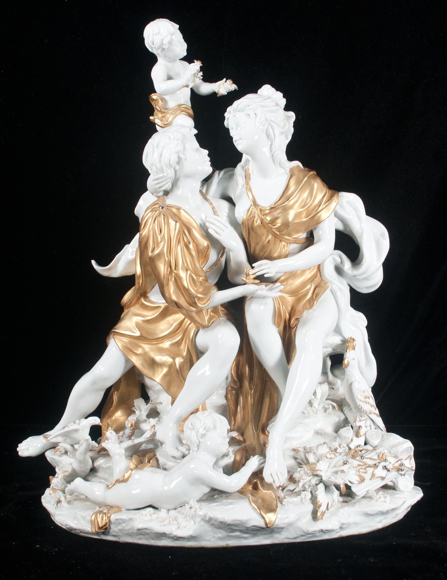 Capo di Monte porcelain figural group: Capo di Monte porcelain figural group with a man and lady seated on a rock formation with a putti beside their heads and one at their feet and birds at their feet, 17" high