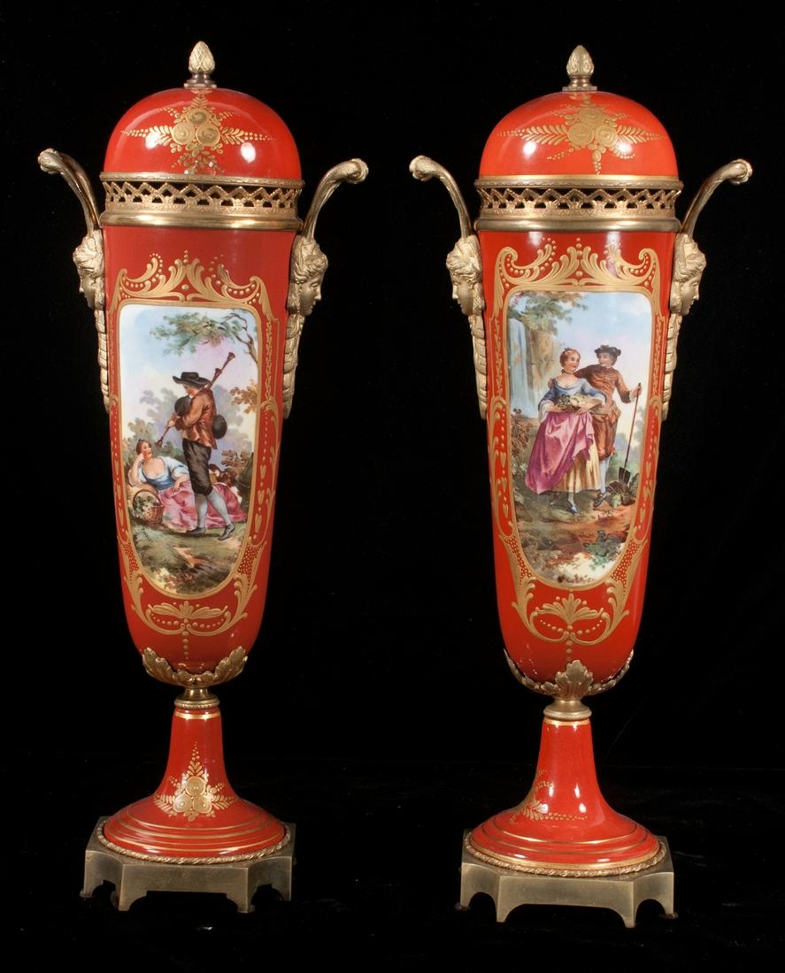 Pair of Sevres porcelain capped vases: Pair of Sevres porcelain capped vases with gilt bronze mounts and handles, each vase has a panel with figural and scenic decoration, c.1900, 19" high
