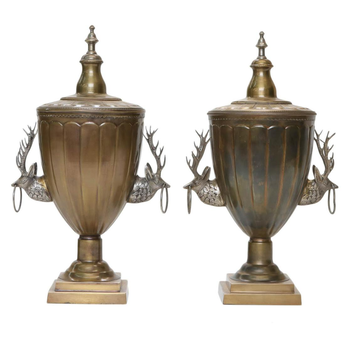 Brass capped fluted pair of urns with double stag head: Brass capped fluted pair of urns with double stag head handles on square bases, 12" wide, 21" high
