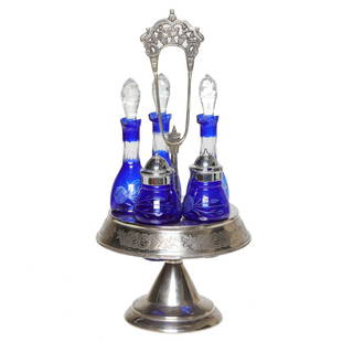 Silver Plated Cruet Set: Silver Plated Cruet Set with Five Cobalt Cut to Clear Crystal Bottles. 7.5" Diameter, 17" High