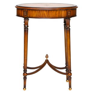 Maitland-Smith Oval Table: Maitland-Smith Oval Table with Inset Tooled Leather Top, Four Turned Legs with Brass Ball Feet and Acorn Finial in Center of Shaped Understretcher. 20.5" Wide, 14.5" Deep, 27" High