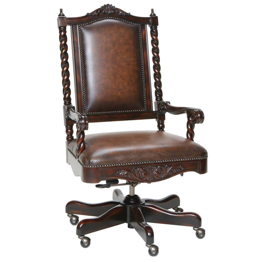 Carved Mahogany Desk Chair with Leather Upholstery: Carved Mahogany Desk Chair with Leather Upholstery and Brass Nail Heads Having Shaped Back Rail, Carved Crest and Apron and Carved Twist Sides and Arm Supports on Six Shaped Legs with Casters with Lev