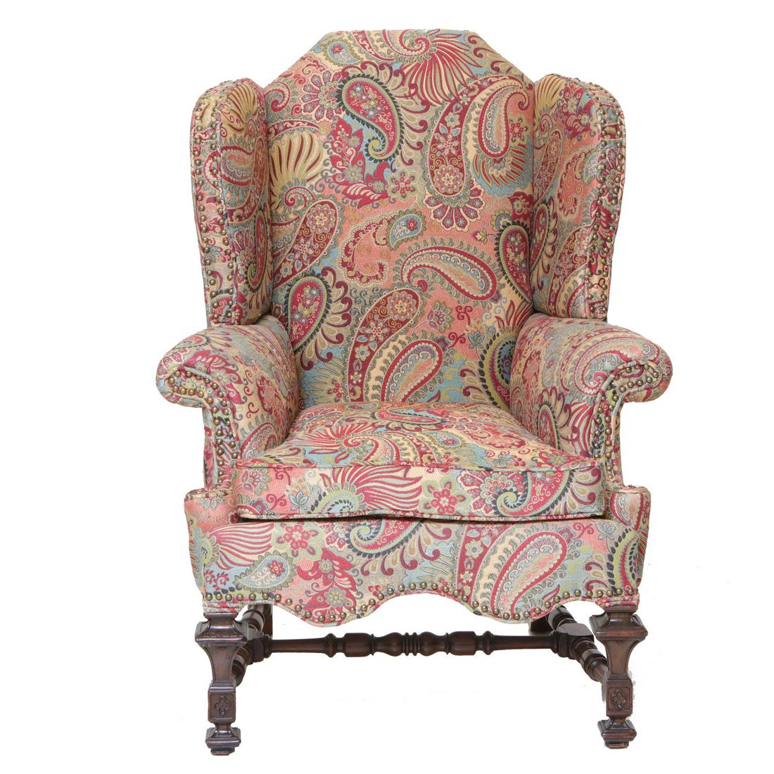 English Mahogany Wing Chair with Shaped Back and Wing: English Mahogany Wing Chair with Shaped Back and Wings, Roll Over Arms and Shaped Apron on Carved Legs with Turned H-Shaped Understretcher with Trefoil Die Block Above Foot. 33" Wide, 26" Deep, 45" Hi