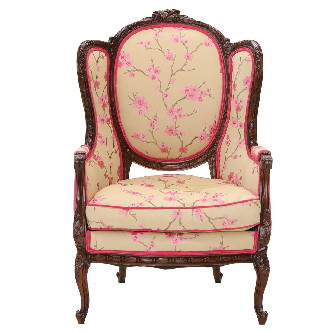 French Style Mahogany Wing Chair: French Style Mahogany Wing Chair with Oval Back Having a Musical Instrument Carved Back Rail, Shaped Wings and Carved Arms, on Cabriole Legs with Carved Knees and Scroll Feet. 29" Wide, 24" Deep, 46"