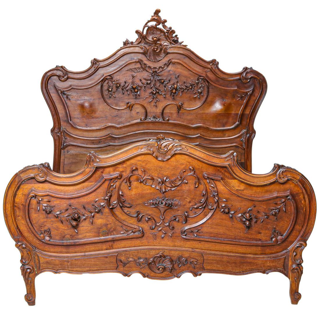 Antique Louis XV Style Provincial Walnut Bed: Antique Louis XV Style Provincial Walnut Bed, Shaped Headboard has a Carved Leaf and Scroll Cartouche and Carved Floral Motif in the Center, Shaped Footboard has a Carved Floral and Leaf Motif, on Cab