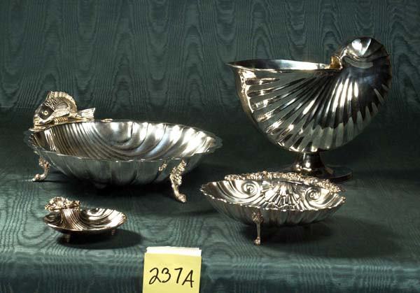 Collection of English silver including three grad: Collection of English silver including three graduated shell shaped serving dishes, one with fish surmount along with open shell on pedestal base, four pieces