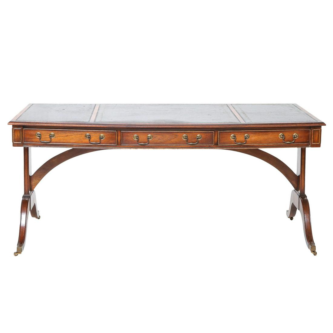 English Reproduction Mahogany Standard End Desk: English Reproduction Mahogany Standard End Desk with Triple Gold Tooled Leather Top, Three Drawers, and Resting on Splay Legs with Brass Casters. 67" Wide, 31.5" Deep, 29.5" High