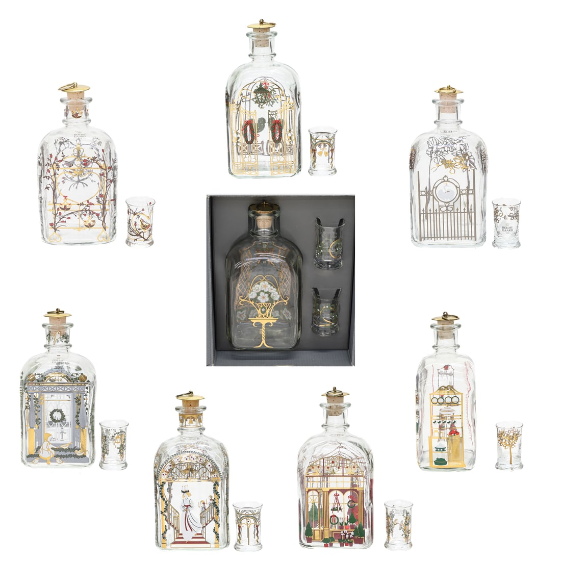 Holmegaard Christmas Decanters, Set of Eight and Nine Companion Aquavit Glasses: Set of Eight Vintage Holmegaard Christmas Decanters and Nine Companion Aquavit Glasses, All Hand-Painted Limited Edition with Scandanavian Scenes Designed by Jette Frolich, Decanters Have Brass Stoppe