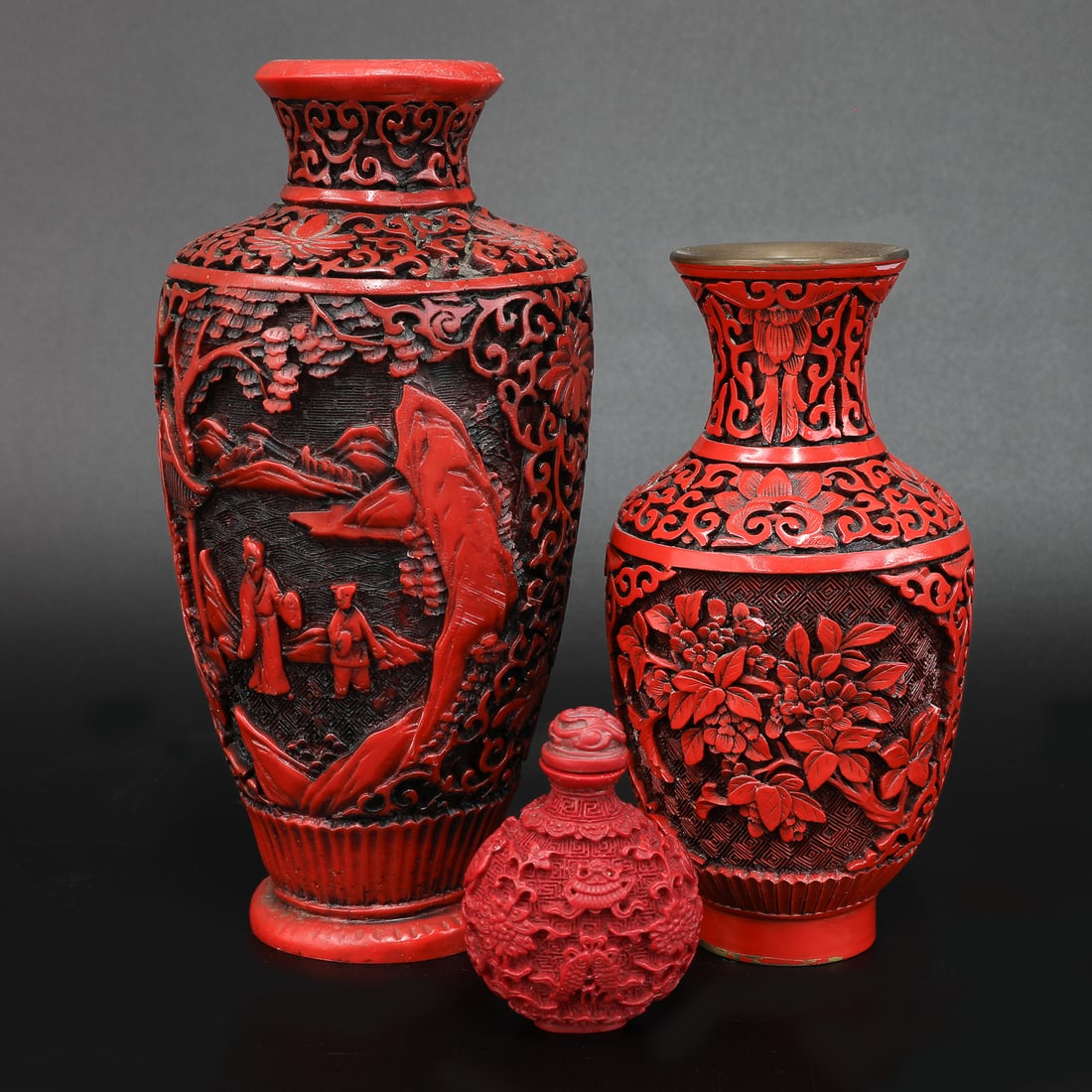 Vintage Group of Chinese Cinnabar Lacquered Carved Items, Three Total: Vintage Group of Chinese Cinnabar Lacquered Carved Items, Three Total, One Hand Carved Vase Having Lotus Flower and Vine Designs, Featuring Figural Courtyard Scene Panel on Each Side, Fluted Base, 4"