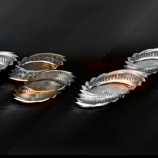 Grouping of Silver Plated and Wood Wine Coasters, Four Total: Grouping of Silver Plated and Wood Wine Coasters, Four Total, Includes a Pair of Philip Ortele Silver Plated Wine Coasters Having Reeded Top Edge abd Pierced Leaf Design Bodies, 5.75" Diameter, 2"