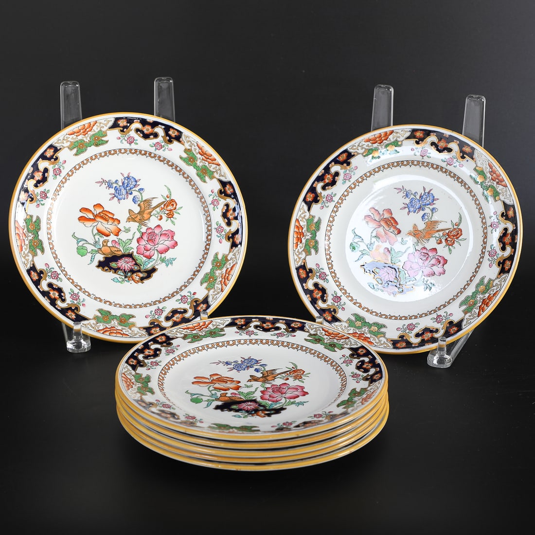 Collection of English Registered Porcelain Dessert Plates, Seven Total: Collection of English Registered Porcelain Dessert Plates, Seven Total, Featuring Bird of Paradise Pattern Depicting Bird and Floral Decorations in Center Surrounded by Floral Border. 8" Diameter, 1"
