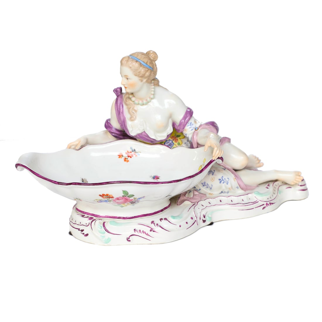 Antique Meissen Porcelain Figural Sweet Meat Dish, Featuring Reclining Lady: Antique Meissen Porcelain Figural Sweet Meat Dish, Featuring Reclining Lady Having One Exposed Breast, Wearing Beaded Necklace, and Clothed in Floral Dress with Lavender Draped Cloth, Dish Having Flor