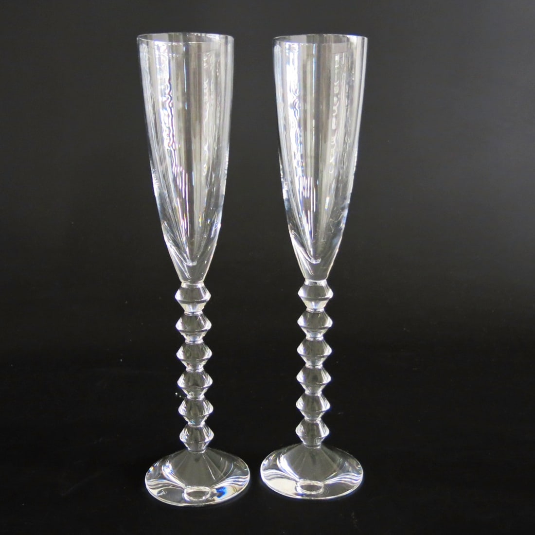 Baccarat Vega Champagne Flutes, Pair: Baccarat Vega Champagne Flutes, Pair, Having Ridged Stems, Marked on Bottom. 2.75" Diameter, 11.5" High