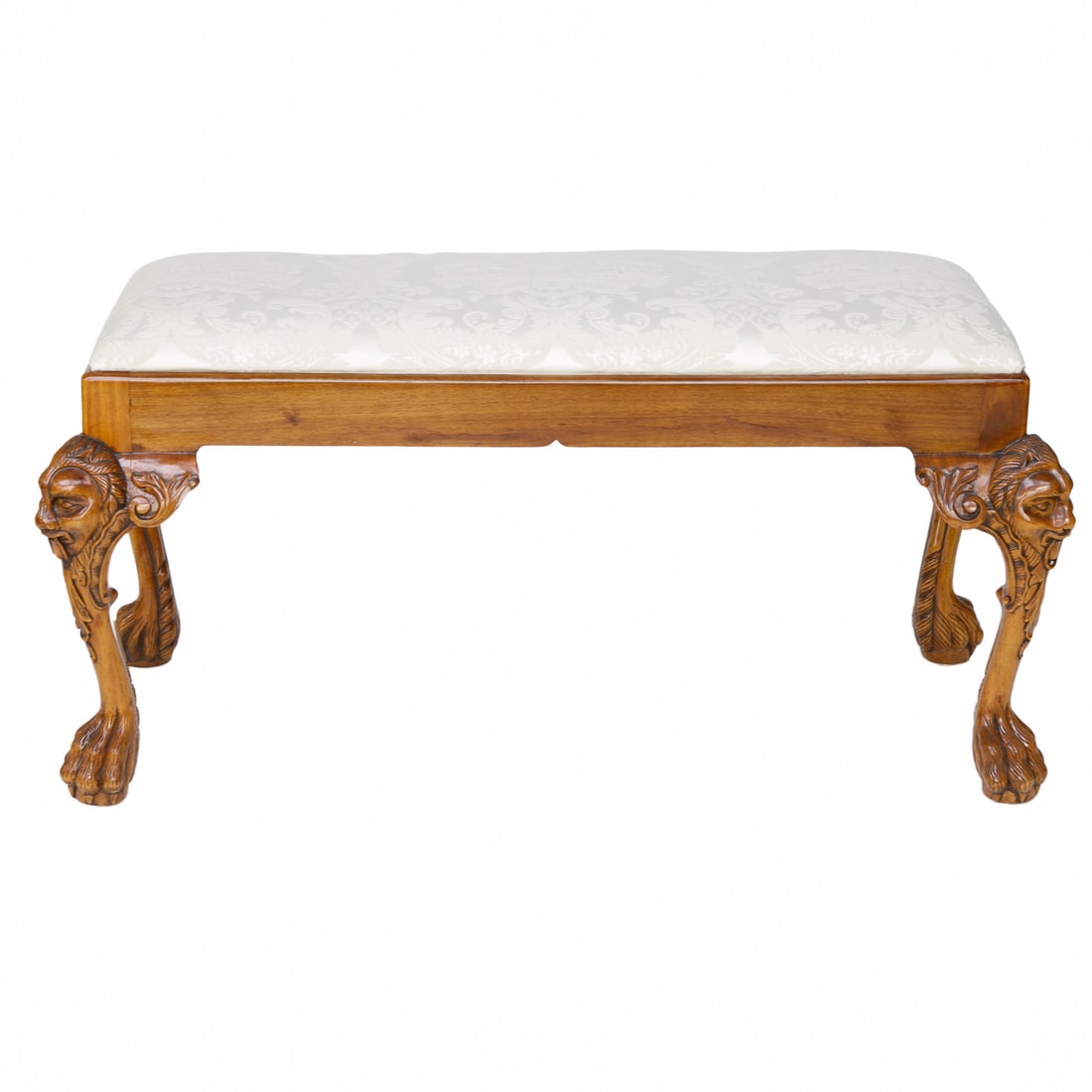 Well Carved Acacia Wood Bench: Well Carved Acacia Wood Bench, Having Lion Mask Carved Knees, Resting on Cabriole Legs, Terminating in Hairy Paw Feet, Upholstered in Beige Floral Fabric. 39.5" Wide, 18.25" Deep, 19" High