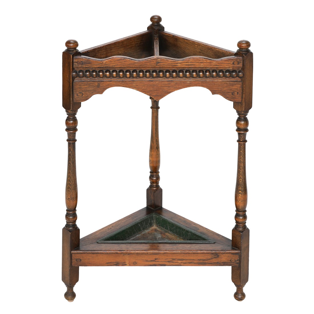 Late 19th C. English Oak Triangular Shaped Umbrella Stand: Late 19th C. English Oak Triangular Shaped Umbrella Stand, Having Turned Finials, Shaped Top Rail Atop Carved Beaded Front, Shaped Apron, Resting on Three Turned Legs, Having Lower Support Shelf Housi