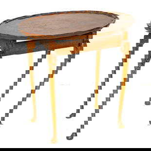 English Walnut Queen Anne Style Oval Side Table: English Walnut Queen Anne Style Oval Side Table, Having Pie Crust Top, Resting on Cabriole Legs Having Leaf Carved Knees, Terminating in Pad Feet. 22" High, 23.5" Wide, 17.5" Deep (One of a Set of Nes
