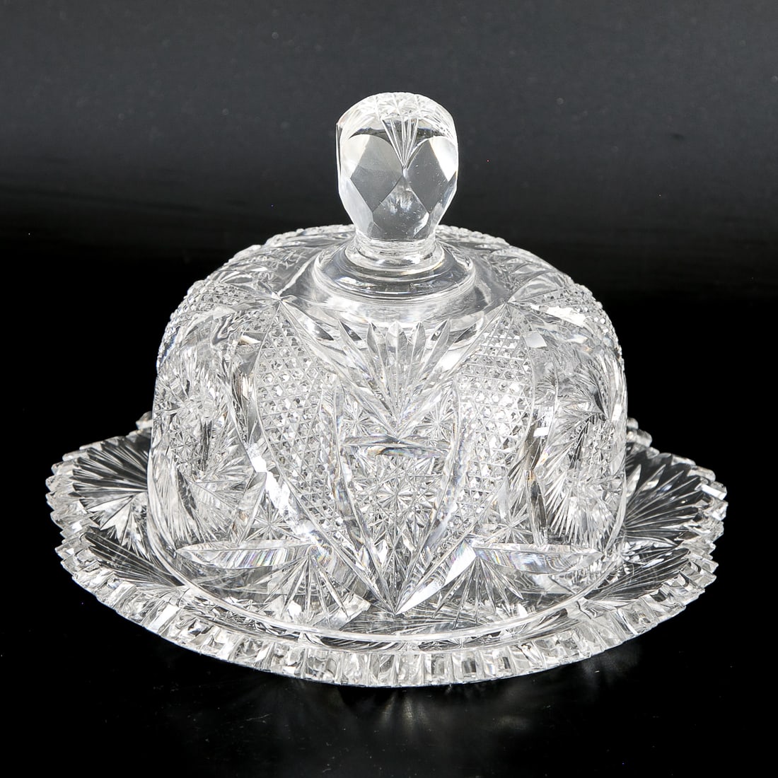 Antique American Brilliant Cut Glass Covered Butter Dish: Antique American Brilliant Cut Glass Covered Butter Dish, Circular Base Features Scalloped Edges, Dome Shaped Lid, Finial Form Handle. 6.75" High, 9" Diameter