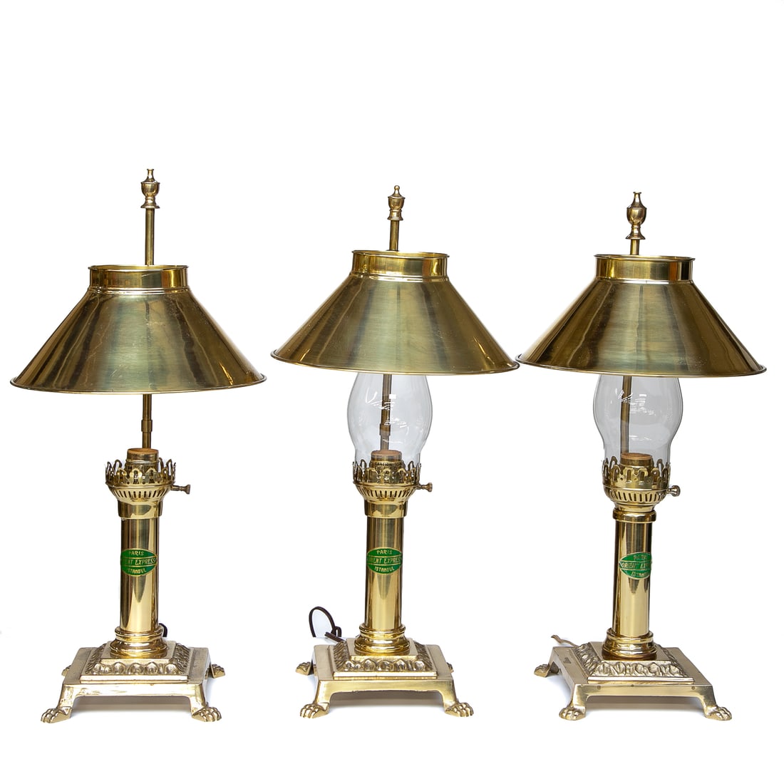 Vintage Brass Orient Express, Paris, Istanbul, Table Lamps, Three Total: Vintage Brass Orient Express, Paris, Istanbul, Table Lamps, Three Total, Having Brass Finial Atop Back Support, Adjustable Circular Tapered Brass Shades, Two Having Glass Chimneys, Turned Center