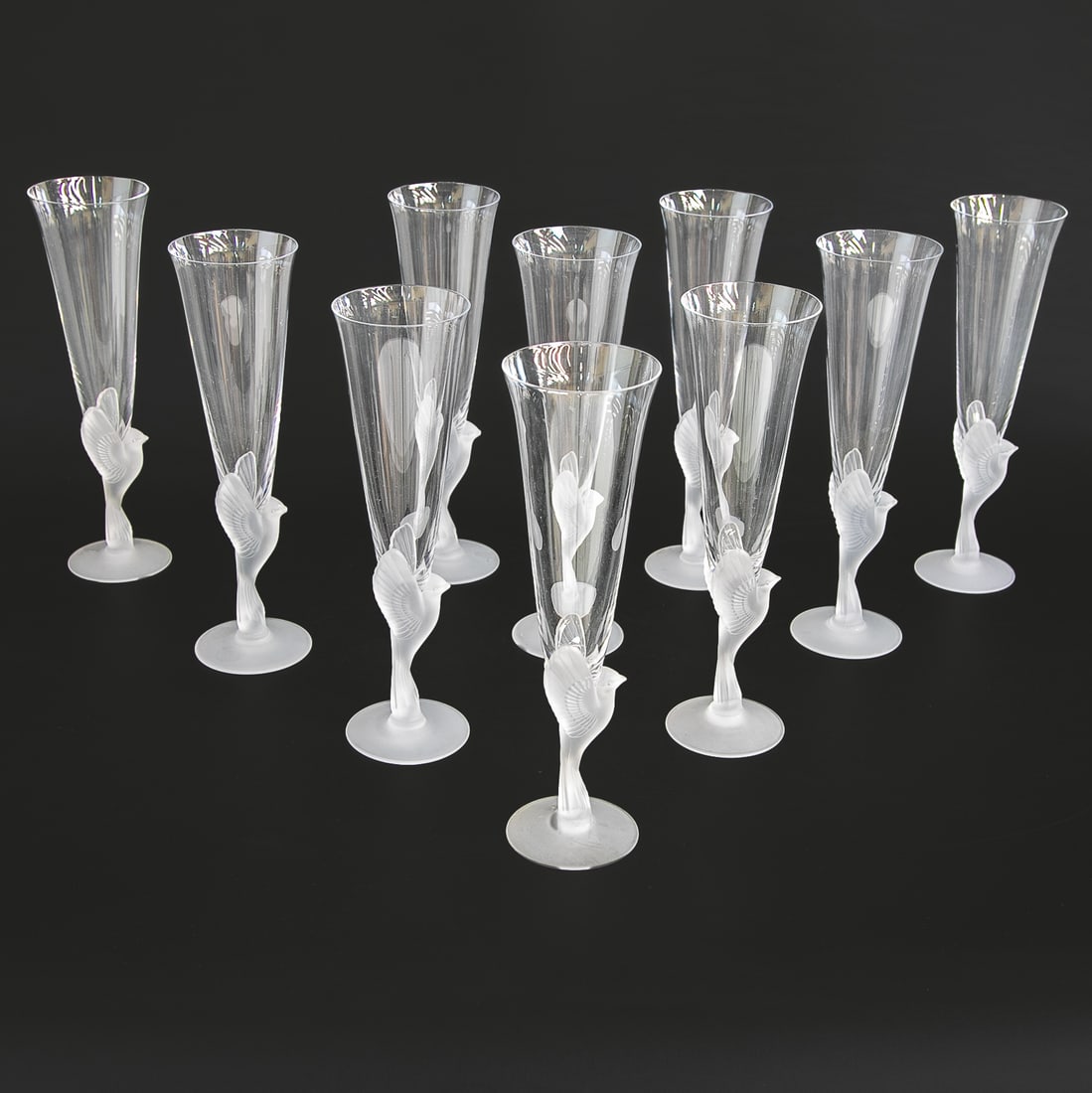 Sasaki Japanese Champagne Flutes, Ten Total: Sasaki Japanese Champagne Flutes, Ten Total, Discontinued, in Wings Pattern, Features Frosted Bird at Base Wings Outstretched, Resting on Frosted Circular Base. 9.25" High, 2.5" Diameter