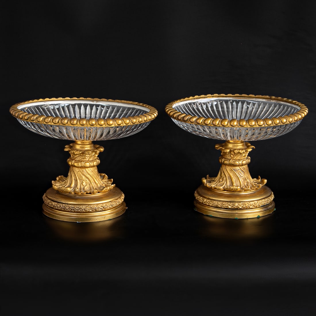 Late 19th C. Gilt Bronze and Crystal French Louis XV Style Centerpieces, Pair: Late 19th C. Gilt Bronze and Crystal French Louis XV Style Centerpieces, Pair, Having Oval Beaded Gilt Bronze Top Edge, Crystal Bowls Featuring Fluted Cuts, Resting on Twisted Acanthus Leaf Form Suppo