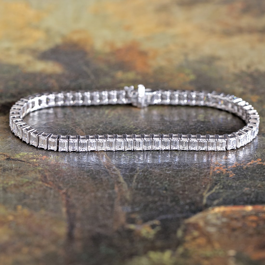 7 Inch 14K White Gold Natural Diamond Line Bracelet: 7 Inch 14K White Gold Natural Diamond Line Bracelet, Consisting of Sixty-Three (63) Natural Emerald-Cut Diamonds Weighing 10.07 Carats. Diamonds are G-H in Color and VS in Clarity. Bracelet Weighs 16.