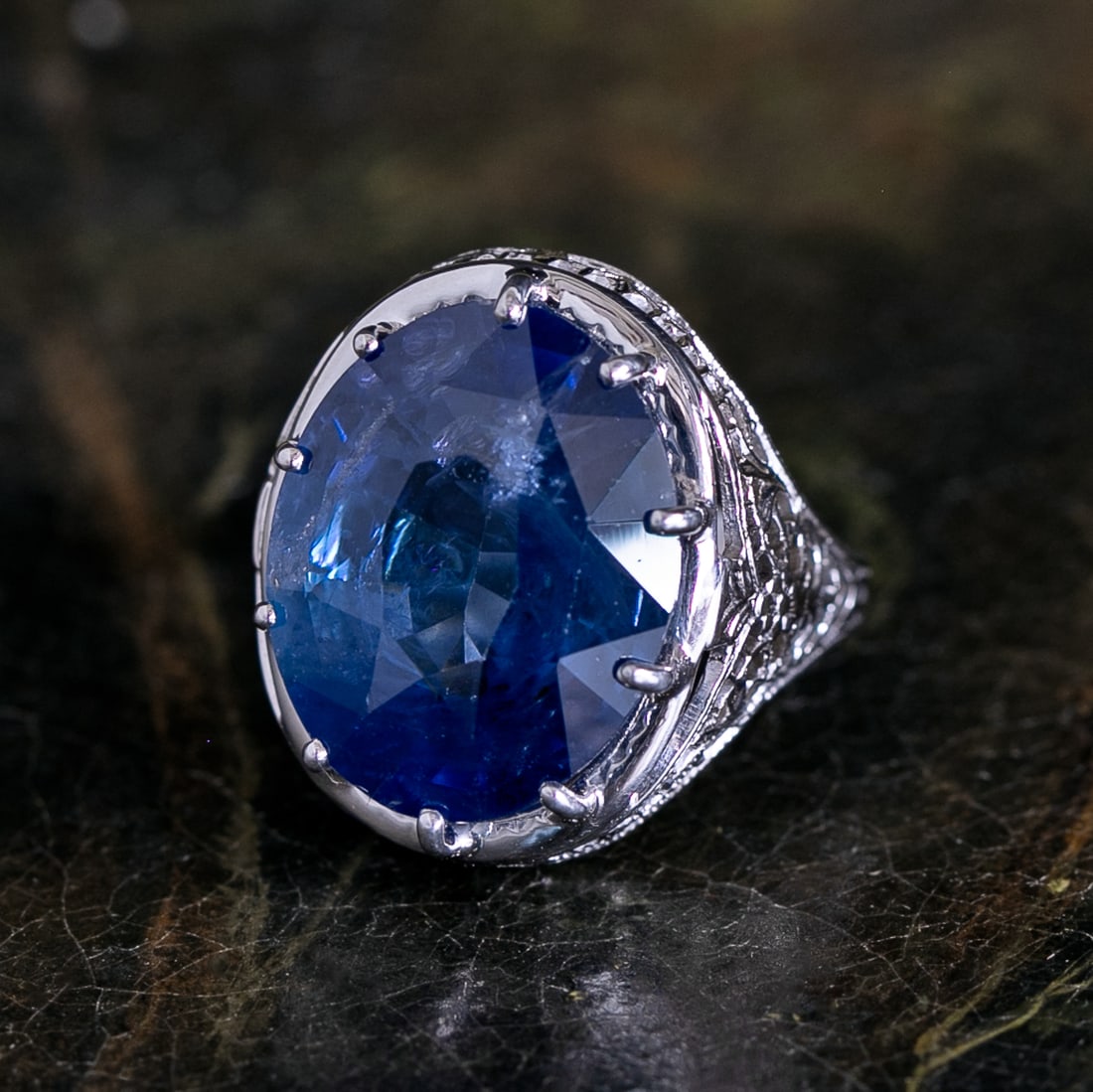 14K White Gold Filigree Natural Blue Sapphire Ring, Size 7: 14K White Gold Filigree Natural Blue Sapphire Ring, Size 7, Containing One Oval Natural Blue Sapphire Weighing 14.50 Carats.