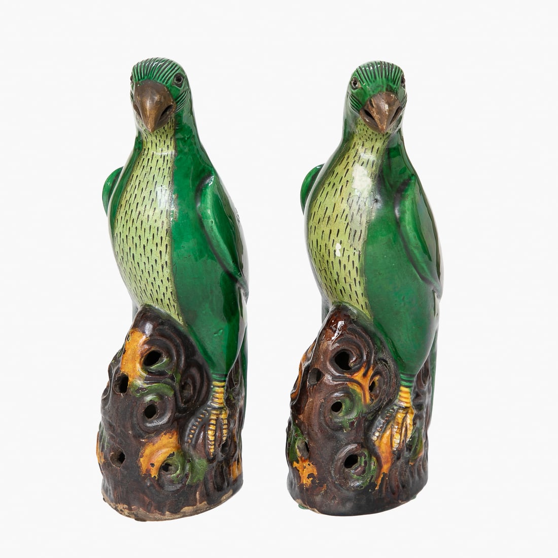 Late 19th C. Chinese Qing Dynasty Glazed Green Parrots, Pair: Late 19th C. Chinese Qing Dynasty Glazed Green Parrots, Pair, Having Emerald Green Bodies, Incised Heads, Breasts Having Lighter Green and Ebony Flecks, Perched on Pierced Brown Ground Form Bases.