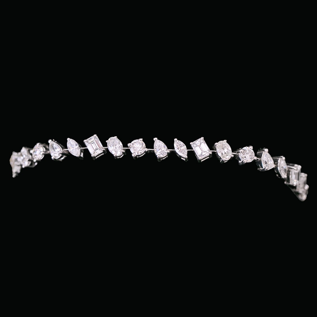 7 Inch 14K White Gold Natural Multi-Shaped Diamond Bracelet: 7 Inch 14K White Gold Natural Multi-Shaped Diamond Bracelet, Consisting of Thirty-Six (36) Natural Multi-Shaped Diamonds Weighing 7.51 Carats. Diamonds are H in Color and VS in Clarity. Bracelet