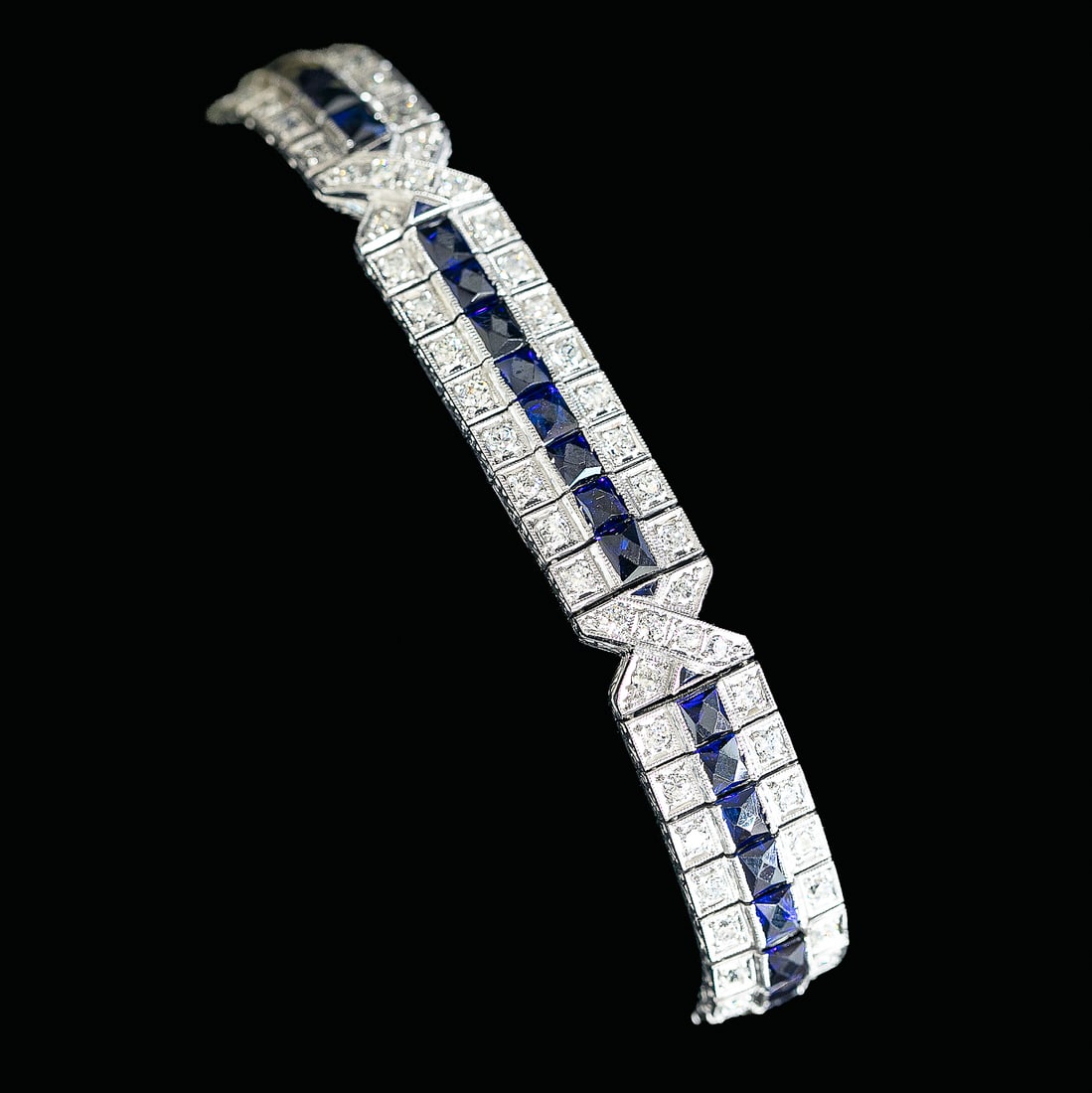 7.25 Inch Art Deco Platinum Natural Diamond and Synthetic Blue Sapphire Bracelet: 7.25 Inch Art Deco Platinum Natural Diamond and Synthetic Blue Sapphire Bracelet, Consisting of One Hundred Ten (110) Natural Round Diamonds Weighing 5.00 Carats. Diamonds are G-H in Color and VS in