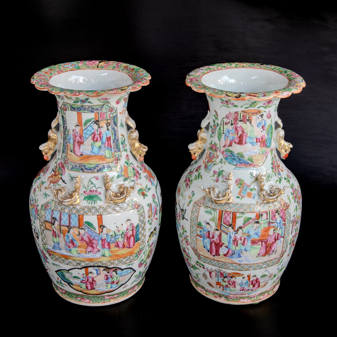 Late 19th C. Chinese Export Rose Medallion Vases, Companion Pair: Late 19th C. Chinese Export Rose Medallion Vases, Companion Pair, Having Scalloped Edges Featuring Multi Color Floral and Butterfly Designs, Tops Feature Figural Village Scenes, Foo Dog Handles, Raise